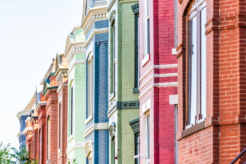 A photo of multi-colored rowhouses
